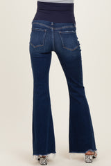 woman wearing dark blue maternity flare jeans with a stretchy navy waistband and back pockets
