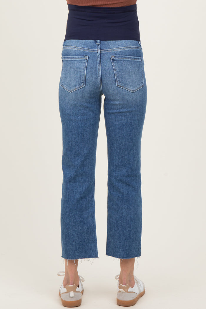 woman wearing blue maternity cropped jeans with a stretchy waistband, seen from the back