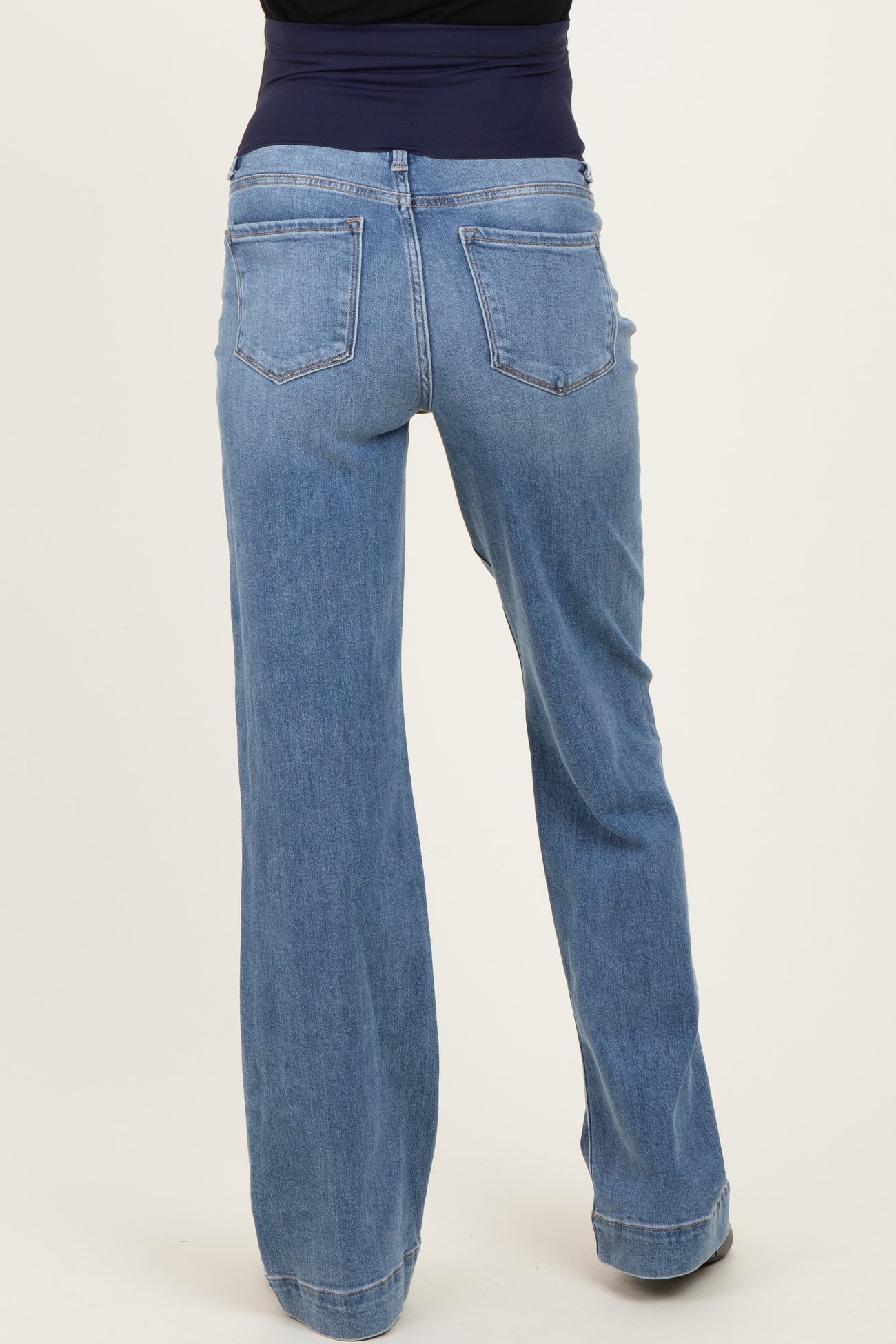maternity wear light blue wide leg jeans shown from the back, featuring a high waist and pockets