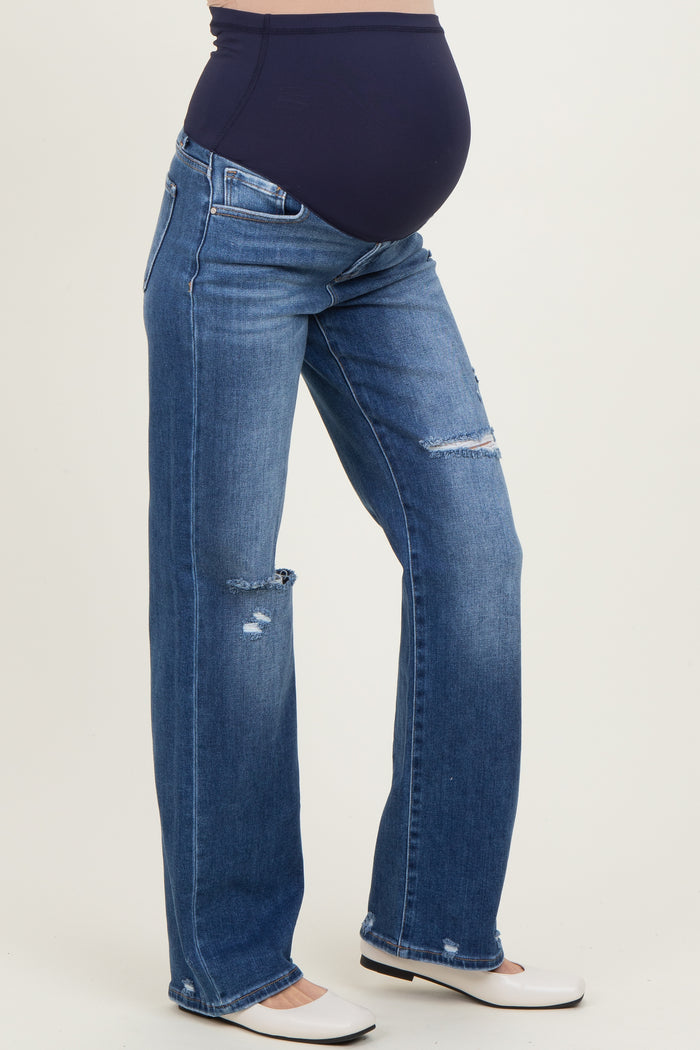maternity wear dark wash distressed straight leg jeans with a stretchy belly panel, model showing her baby bump