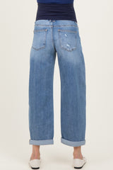 woman wearing light blue maternity wide-leg jeans, shown from the back with rolled cuffs and a distressed detail