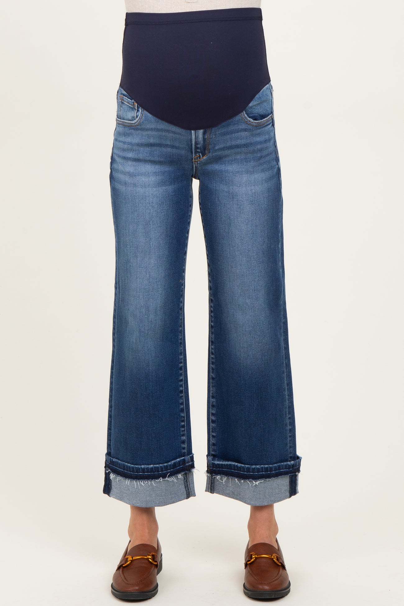 maternity wear dark blue wide-leg cropped jeans with a stretchy belly band, worn by a model standing upright
