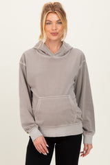 woman wearing a gray maternity hoodie with a front pocket and a relaxed fit