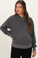 woman wearing a gray oversized maternity hoodie with a front pocket and relaxed fit