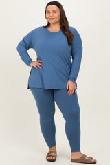 woman wearing a blue long sleeve top and matching leggings in a plus size fit