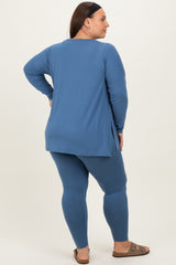 woman wearing a blue long sleeve top and matching leggings in a plus size fit, viewed from the back