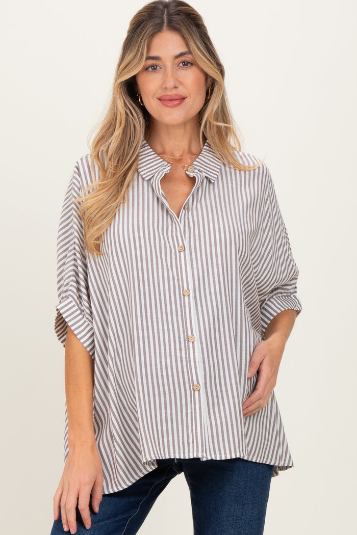 woman wearing a beige and white striped maternity shirt with a button-down front and short sleeves
