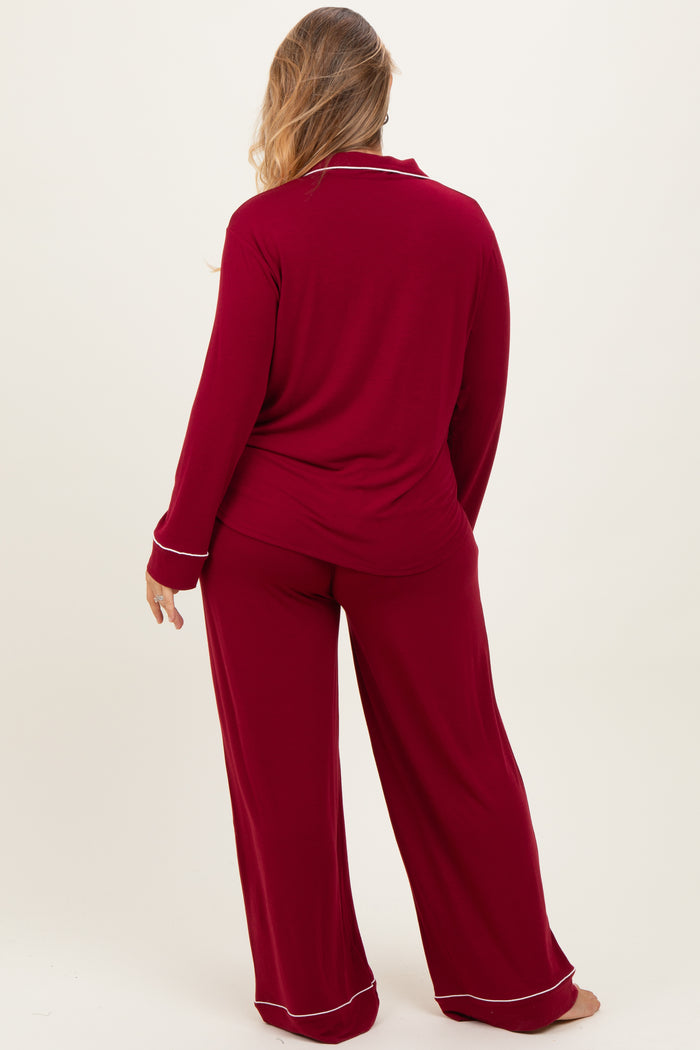 woman wearing a red maternity plus pajama set with long sleeves and wide-leg pants, viewed from the back