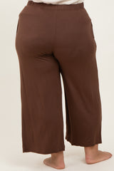 back view of woman wearing brown plus size culotte pants with side pockets