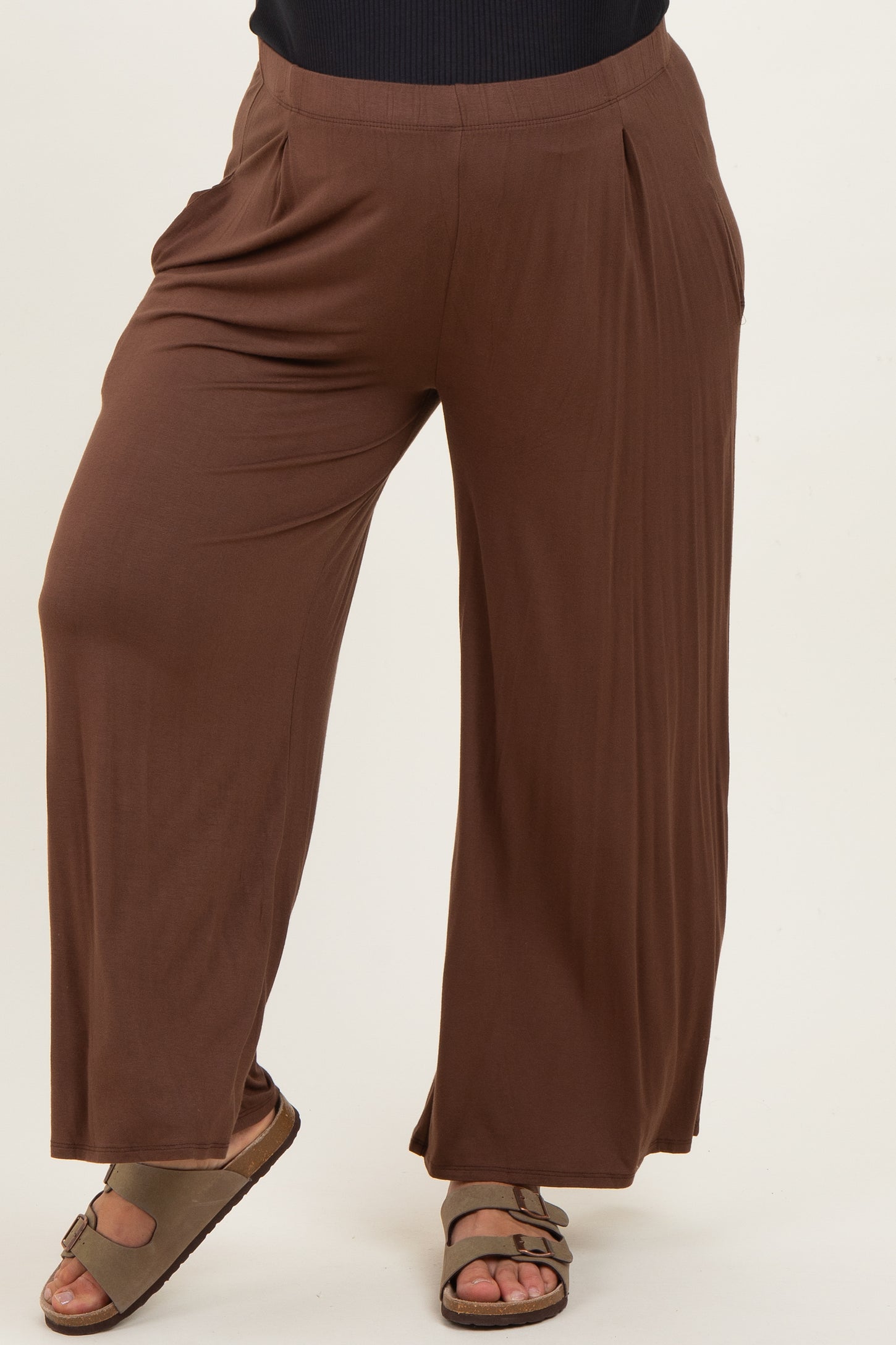 woman wearing brown maternity plus wide-leg pants with side pockets