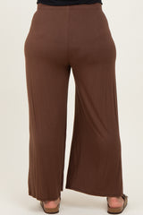 woman wearing brown wide-leg maternity pants seen from behind