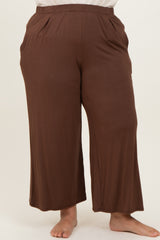 woman wearing brown plus size wide-leg pants with pockets