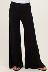 woman wearing black wide leg palazzo pants with a comfortable elastic waistband