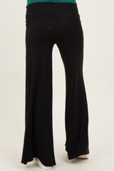 woman wearing black maternity wide-leg pants with a comfortable waistband, viewed from the back