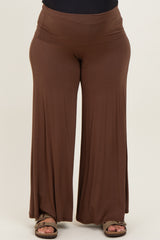woman wearing a brown maternity plus wide-leg pants with a comfortable high waistband