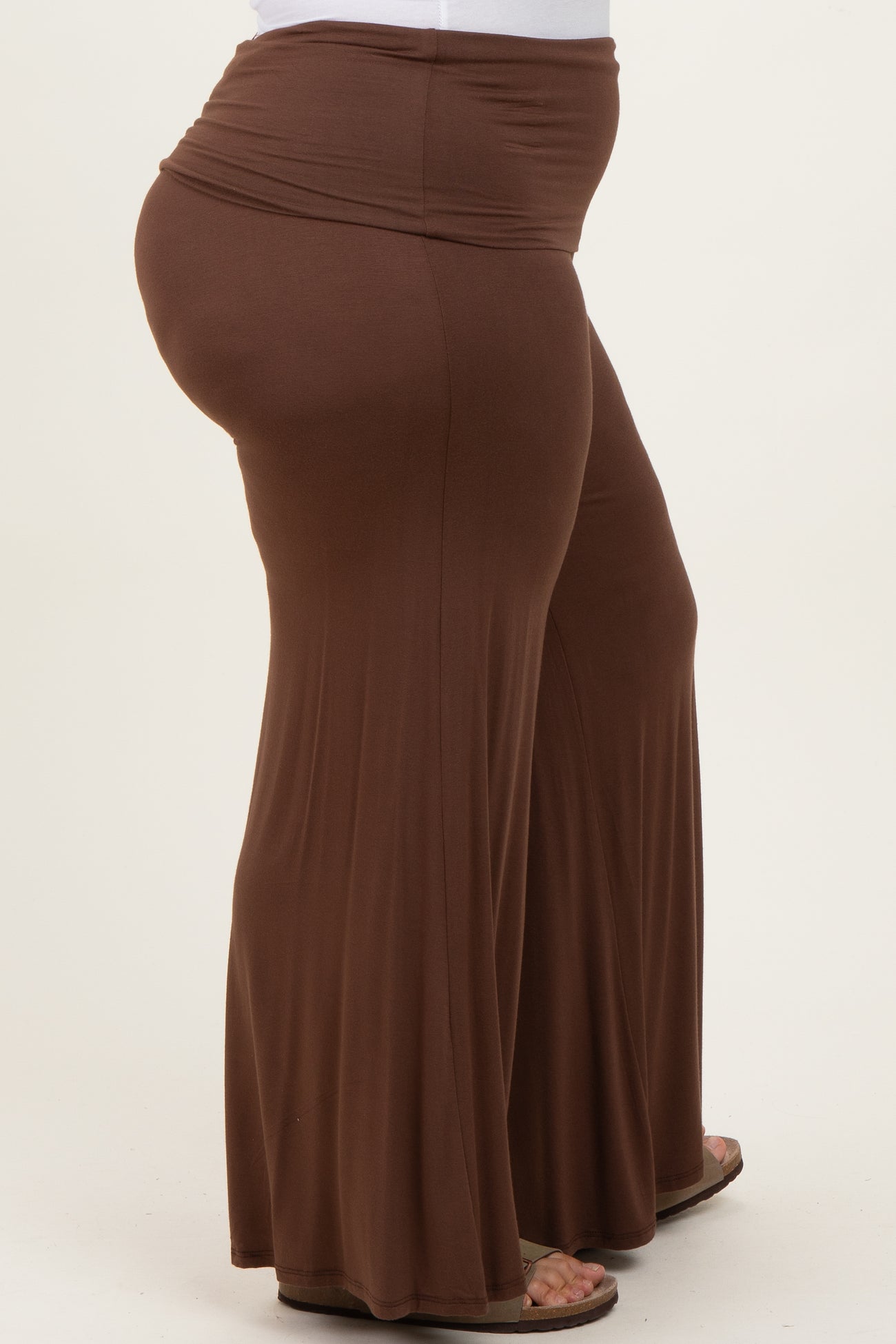 woman wearing brown plus size wide leg pants with an elastic waistband