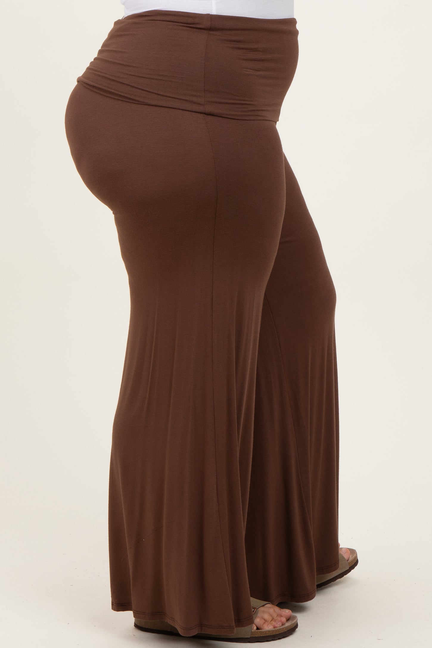 woman wearing brown plus size wide leg pants with an elastic waistband