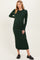 woman wearing a dark green ribbed maternity dress with long sleeves and a fitted silhouette, showcasing a baby bump