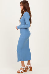 woman wearing a light blue ribbed long sleeve midi dress and chunky heeled sandals