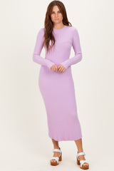 woman wearing a light purple ribbed long sleeve midi dress and white platform sandals