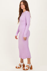 woman wearing a light purple ribbed knit long sleeve midi dress and white platform sandals
