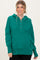 woman wearing a green hoodie with buttons and a relaxed fit