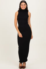 woman wearing a black ribbed sleeveless maxi dress with a turtleneck and fitted silhouette
