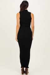 woman wearing a black sleeveless ribbed maxi dress, shown from the back