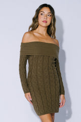 woman wearing a brown off-shoulder cable knit sweater dress with long sleeves