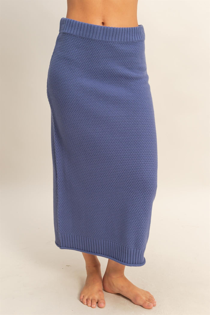 woman wearing a blue knitted maxi skirt with a cozy ribbed waistband