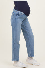 woman wearing light blue maternity jeans with a navy waistband and a visible baby bump