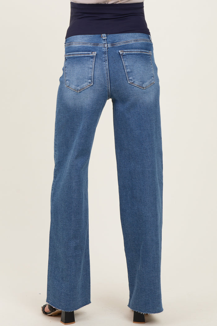 woman wearing blue maternity jeans with a high waist and wide-leg style, showing the back view