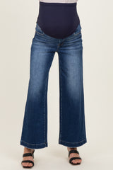 woman wearing wide-leg maternity jeans with a navy blue over-the-bump panel