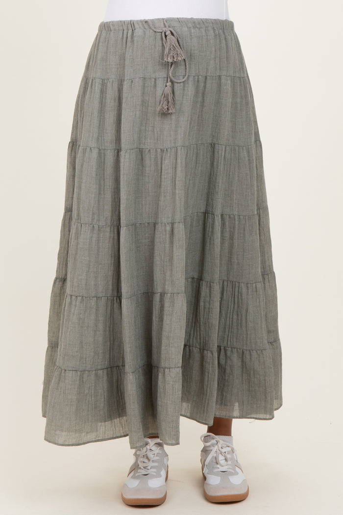 maternity wear gray tiered maxi skirt with adjustable drawstring and tassel detail, paired with white sneakers
