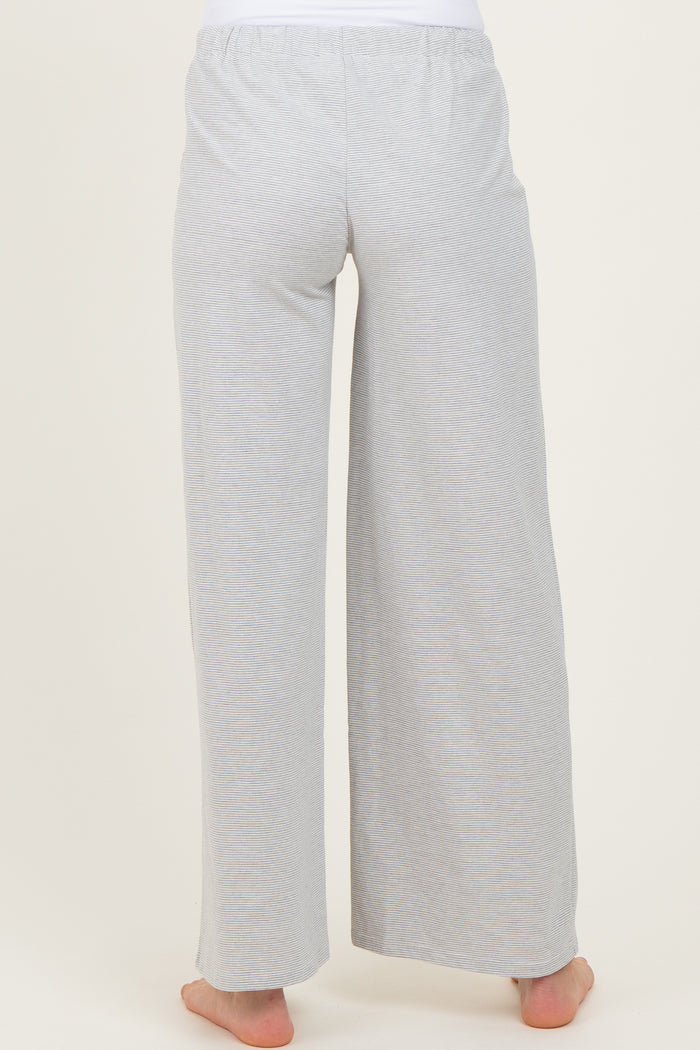 woman wearing light gray maternity lounge pants, shown from the back
