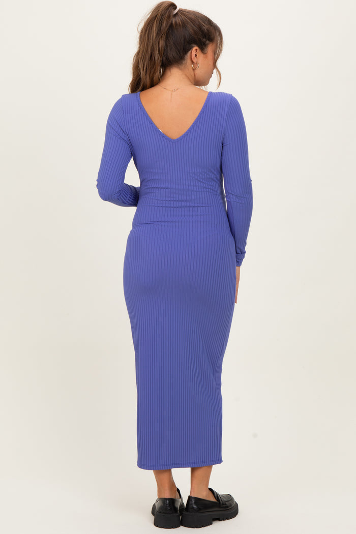 woman wearing a purple ribbed maternity dress with a v-back and long sleeves