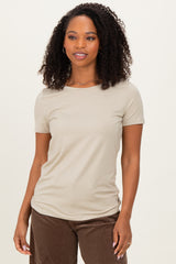 woman wearing a beige short sleeve t-shirt with a round neckline and sleek fit