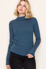 woman wearing a navy blue and white striped long sleeve top with a mock neck and slim fit	style