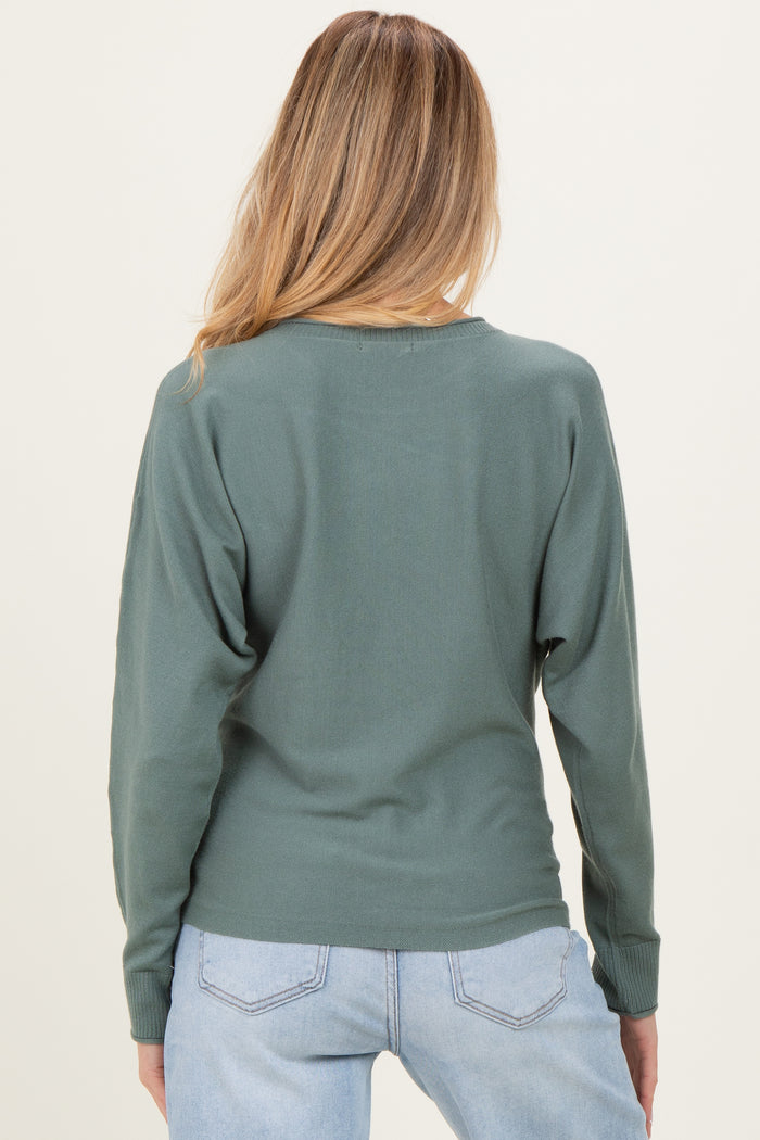 woman wearing a green back view long sleeve maternity top with a relaxed fit and dropped shoulders