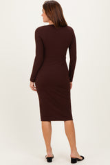 woman wearing a brown long sleeve midi dress with a fitted silhouette, viewed from the back