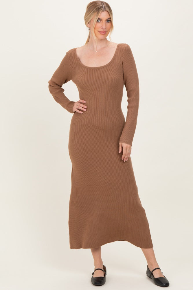 woman wearing a brown ribbed long sleeve midi dress with a scooped neckline and a fitted silhouette