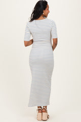 woman wearing a striped maternity maxi dress with short sleeves, showing a fitted silhouette from the back