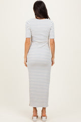 woman wearing a fitted maxi dress with horizontal blue and white stripes and short sleeves, viewed from the back