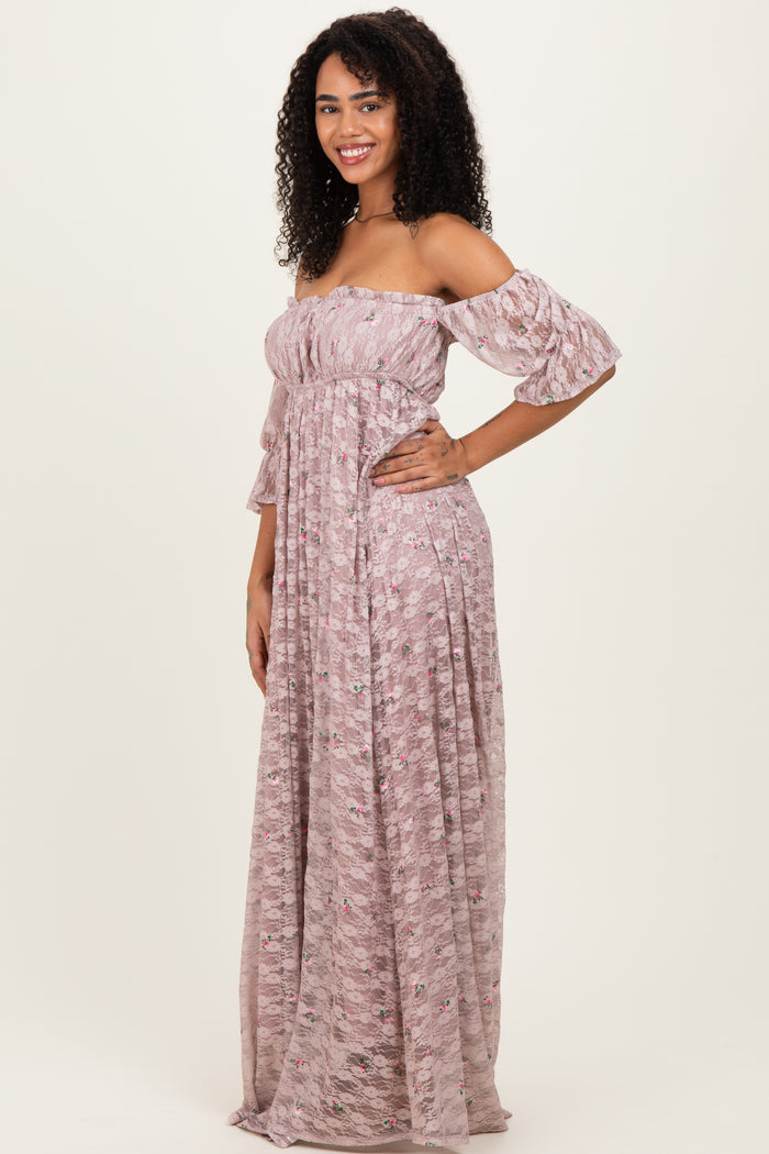 woman wearing a pink off-the-shoulder long floral maxi dress with ruffled sleeves