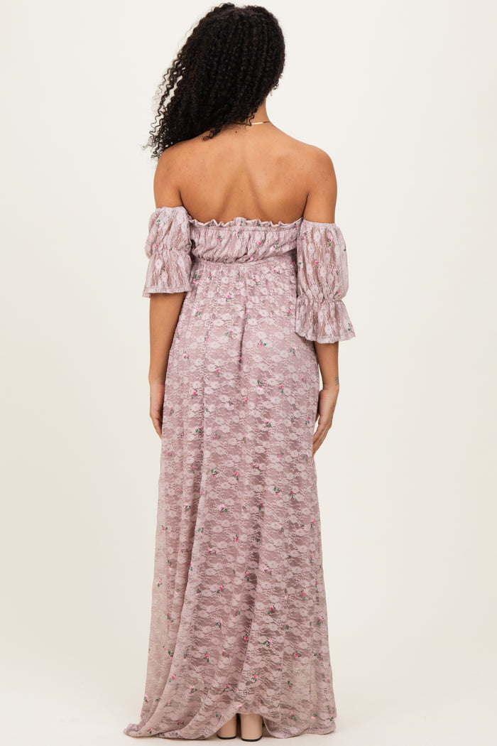 woman wearing a lavender off-the-shoulder maxi dress with puff sleeves and a floral pattern, seen from the back