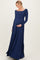 woman wearing a navy long sleeve maternity dress with a fitted bodice and flowy skirt, holding her baby bump
