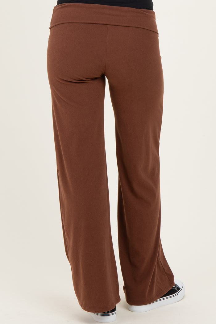 woman wearing brown maternity wide-leg pants, view from the back