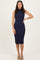 woman wearing a navy blue ribbed midi dress with a high neckline and fitted style
