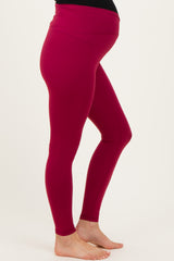 maternity wear burgundy leggings with a high waistband designed for comfort and support, showcasing a baby bump