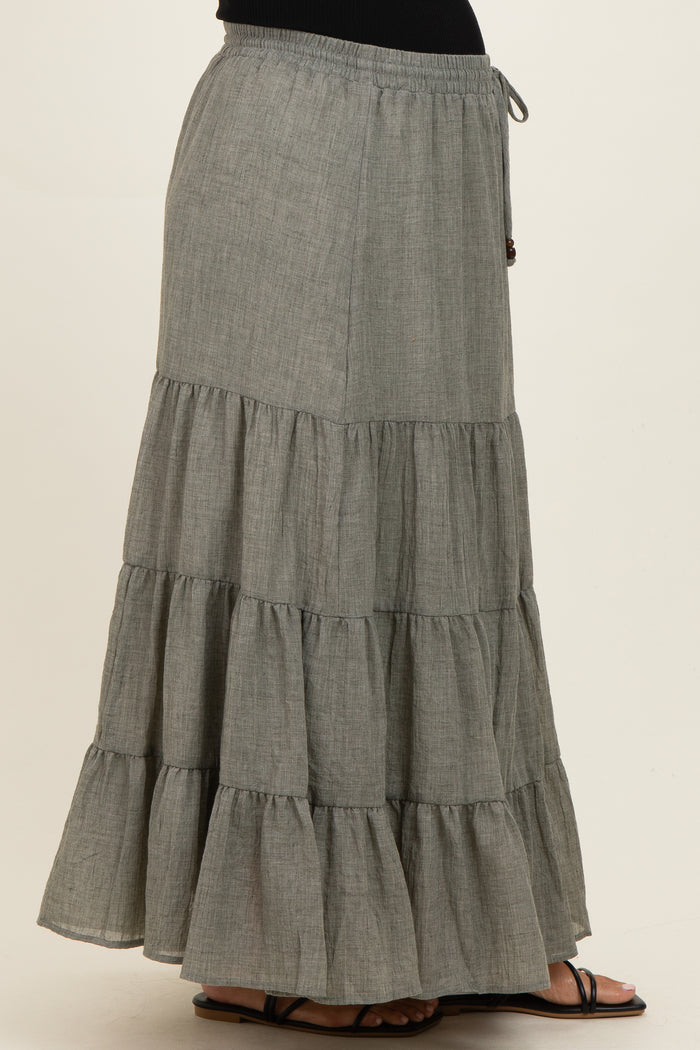 woman wearing a gray tiered maternity maxi skirt with an elastic drawstring waistband